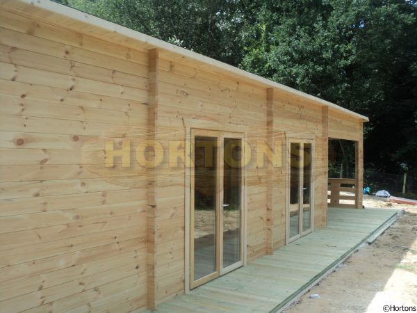 14.0 x 4.0m 45mm Twinskin Pent roof log cabin with barbecue area - Click Image to Close